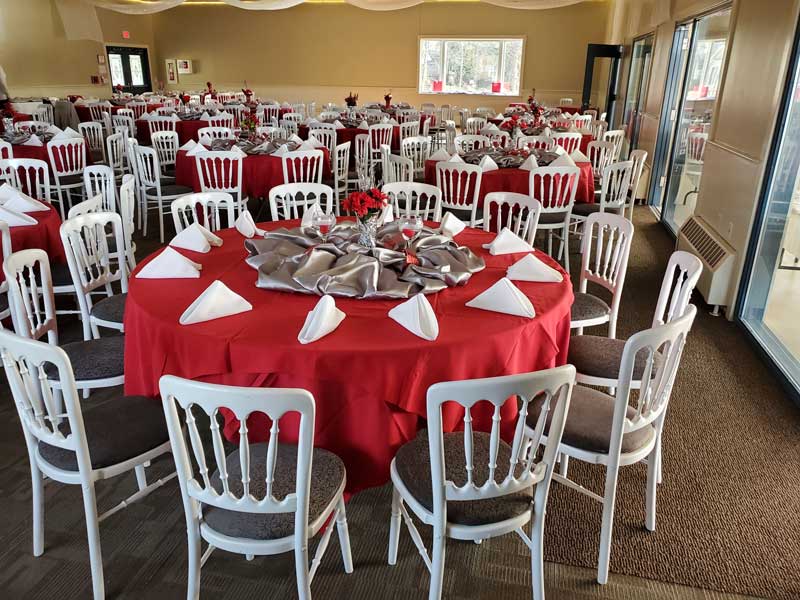 Round tables for 12 - wooden chairs, many windows, room is light beige