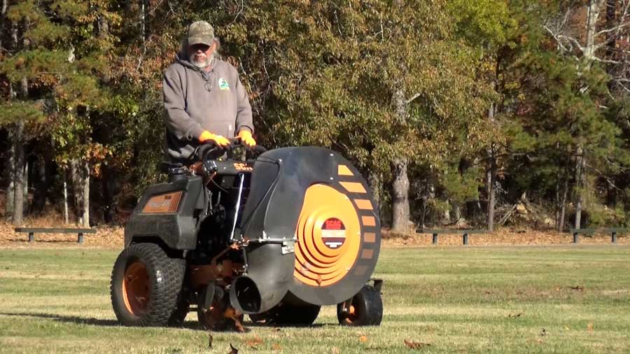 Groundskeeper blowing leaves