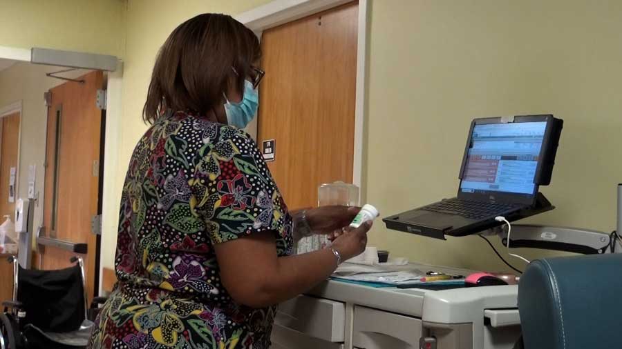 Women monitoring medication on a computer