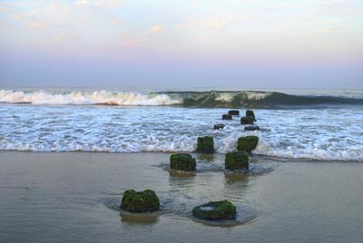 Ocean jetty with wave crashing